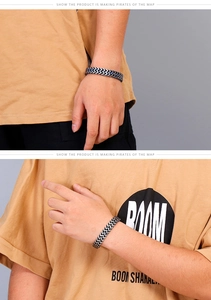 Detail of silver and black stainless steel fishtail link chain bracelet for men