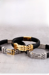 Macro detail of men's braided leather bracelet with 316L stainless steel buckle
