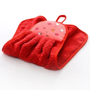 Detail of red dress-shaped hanging towel in coral fleece with apple pattern print