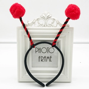 Cute black insect headband with red pom-poms and spiral feelers for cosplay parties