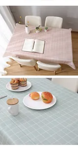 Close-up of pink and green checkered waterproof PEVA tablecloth with texture detail