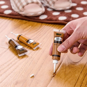 Precision wood filler tube repairing light walnut furniture scratches on wooden floor