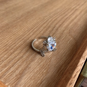 Close-up of 925 sterling silver crown ring with cubic zirconia and chain detail