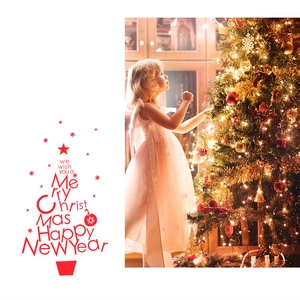 Girl in white dress decorating a glowing Christmas tree with warm holiday greetings