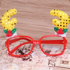 Festive red Christmas reindeer glasses with yellow glitter antlers for party decoration