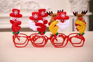 Detail of four cartoon Christmas glasses with Santa, snowman, and reindeer glitter designs
