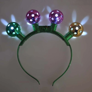 Green LED disco ball headband for party festivities with glowing colorful metal balls
