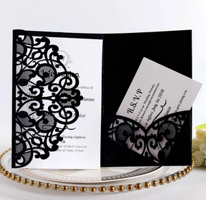 Detailed laser-cut floral lace wedding invitation set with black sleeve and white cards