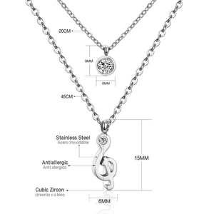 Detail of stainless steel double chain necklace featuring musical note and zircon pendant