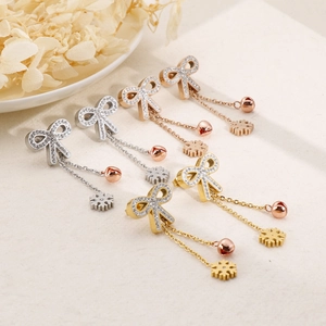 Bowknot titanium steel earrings with rhinestone bells and snowflakes in three metallic colors