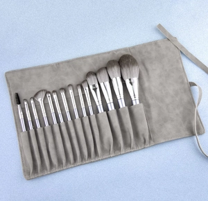 Set di 14 pennelli da trucco professionali con manici viola e custodia a rotolo grigia