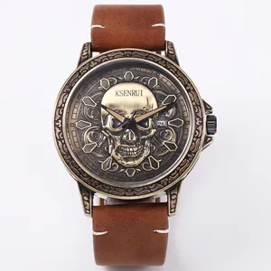 Gothic retro skull watch with bronze case, brown leather strap, and date display