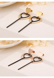 Détails de boucles d'oreilles cœur en or et or rose avec pendentifs creux noirs