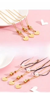 Detail of 18K gold-plated heart necklace with Love engraving and elegant pearl pendant