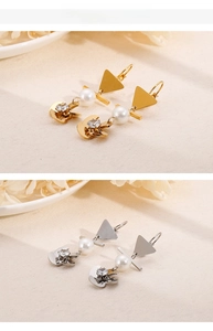 Detailansicht barocker geometrischer Perlenohrringe in Gold und Silber für eleganten Look