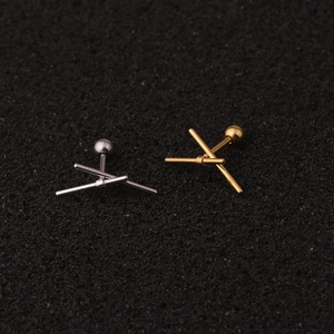 Detail view of gold and silver stainless steel screw back crown stud earrings