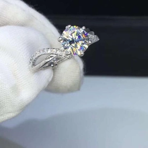 Sparkling zircon wedding ring with six-prong setting and twisted diamond-set band