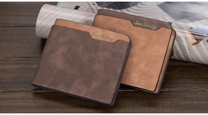 Detail of slim men's fold wallets in dark and light brown soft leather on a wooden desk