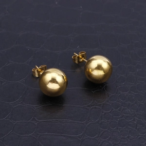Polished 18k gold plated stainless steel hollow ball stud earrings on black leather