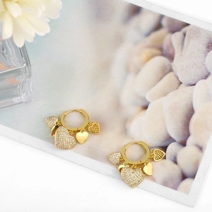 Elegant 18K gold heart dangle earrings with crystal pavé and polished charms