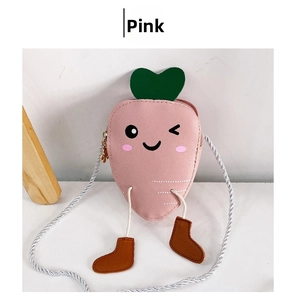 Detailed view of pink carrot-shaped kid crossbody bag with cute cartoon face and green leaves