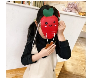 Cute carrot-shaped crossbody bag for children with a smiling face and green leaves