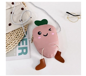 Detailed close-up of a pink carrot-shaped kid's crossbody bag with leaf decoration