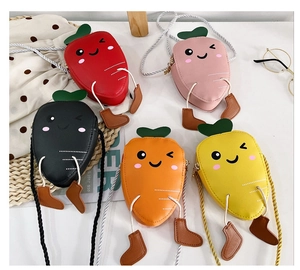 Mini carrot-shaped shoulder bags for kids shown in five bright colors on a white tabletop