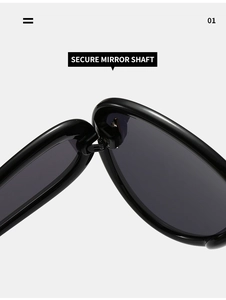 Vue détaillée de la charnière et de l'axe de miroir sur des lunettes de soleil noires