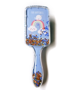 Close-up of blue glitter hairbrush with sequins, narwhal print and FOR HAPPINESS text