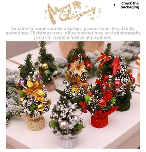 Detailed view of 20cm mini Christmas tree with snow effect and festive ornaments