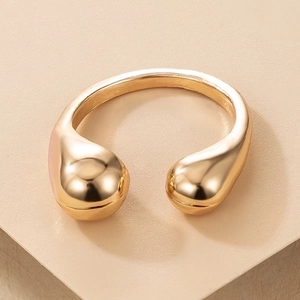 Minimalist gold open ring with polished drop-shaped spherical design in a modern style