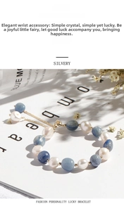 Detailed shot of blue aventurine and freshwater pearl beaded bracelet with gold chain