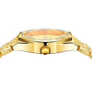 Detailed side view of golden quartz watch showing the crown and crystal-encrusted band
