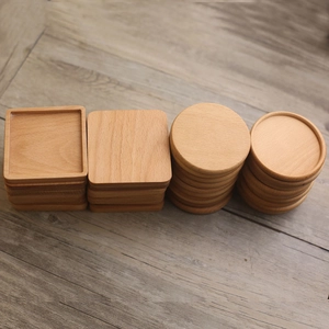 Square and round beech wood coasters set in flat and recessed styles on a wooden surface