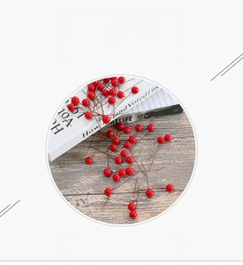 Detailed close-up of artificial red berries with natural matte texture for home decor