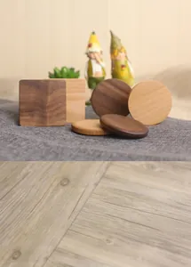 Macro detail of round and square solid wood coasters in walnut and beech wood finishes