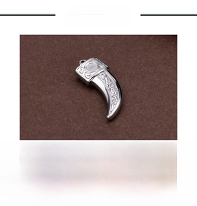 Detailed view of 16g gothic stainless steel wolf tooth pendant with vintage texture