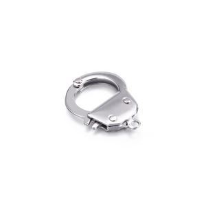 Polished silver stainless steel handcuff charm pendant with metal link on white background