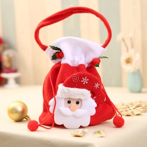 Red Christmas Santa doll gift bag with white plush trim and holly berry details