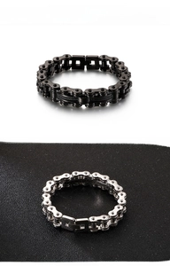 Close-up of titanium steel motorcycle chain bracelet in matte black and silver finishes