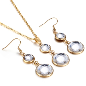Elegant gold necklace and earring set with double-layered clear crystal pendants