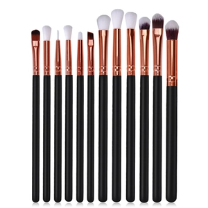 12-piece professional rose gold makeup brush set with black handles and white bristles