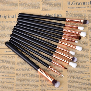 Macro detail of 12pcs rose gold makeup brush set with synthetic bristles and matte handles