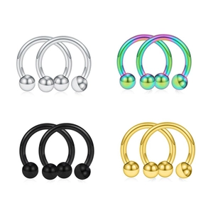 Detailed set of four stainless steel horseshoe rings in silver, rainbow, black, and gold