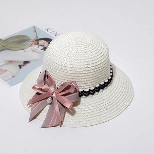 White woven sun hat with wave pattern ribbon and large pink silk bow decoration