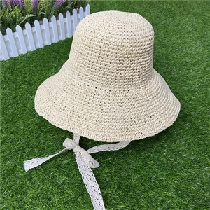 Beige wide brim straw sun hat with white lace ribbon bow for women and kids beachwear