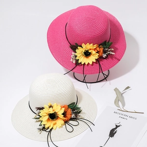 Women's summer straw sun hats with sunflowers in pink and white for outdoor leisure