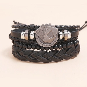 Vintage multilayer black leather bracelet set featuring woven cords and poker pattern charm