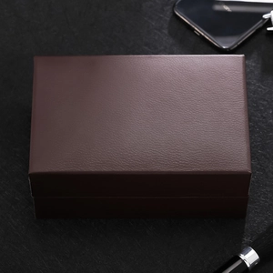 Detail of premium dark brown rectangle gift box with elegant lychee leather texture